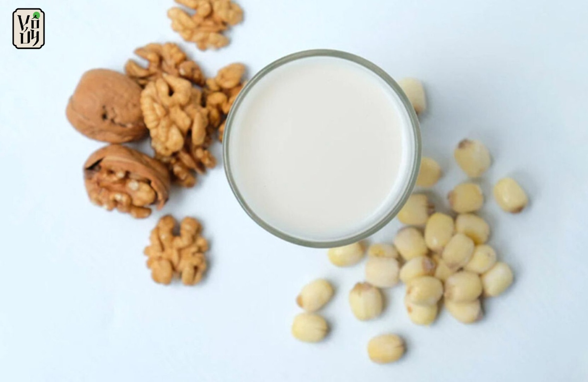 a glass of milk and nuts